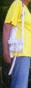 homemade woven handbag hanging on shoulder