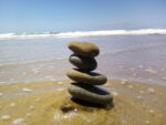 Beach Rock Tower with water around its base.